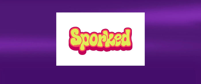 Sporked logo on a vibrant purple background, showcasing a playful brand identity.