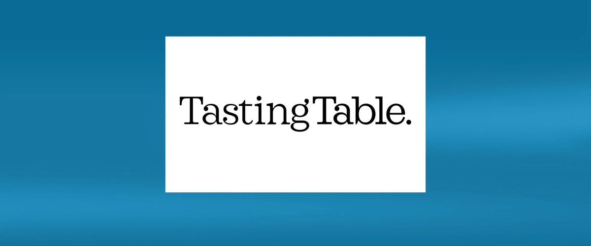 Logo of Tasting Table displayed on a blue background.