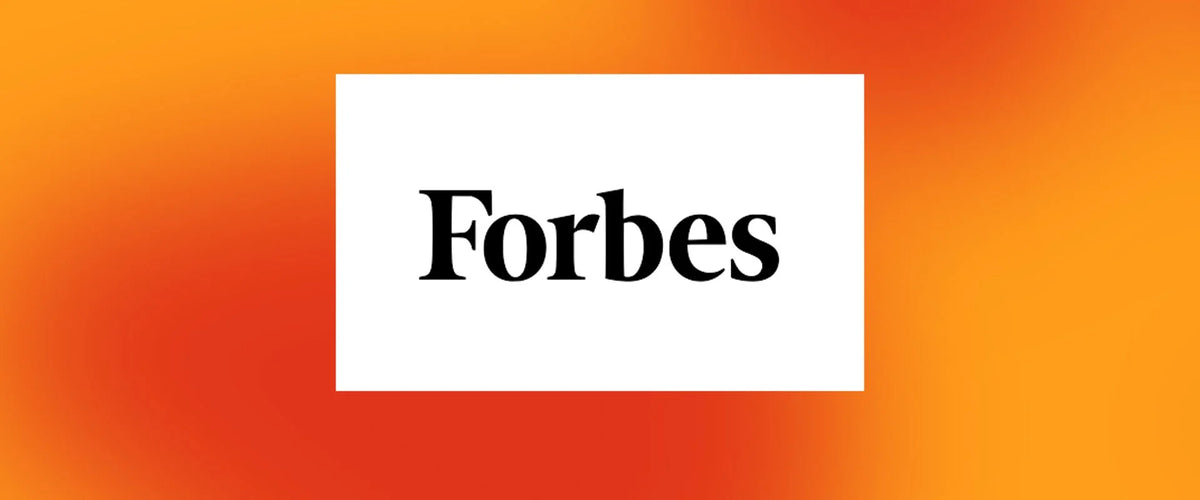 Forbes magazine logo on a vibrant orange background.