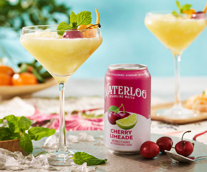 Refreshing cherry limeade cocktail with Waterloo sparkling water and fresh mint garnishes.
