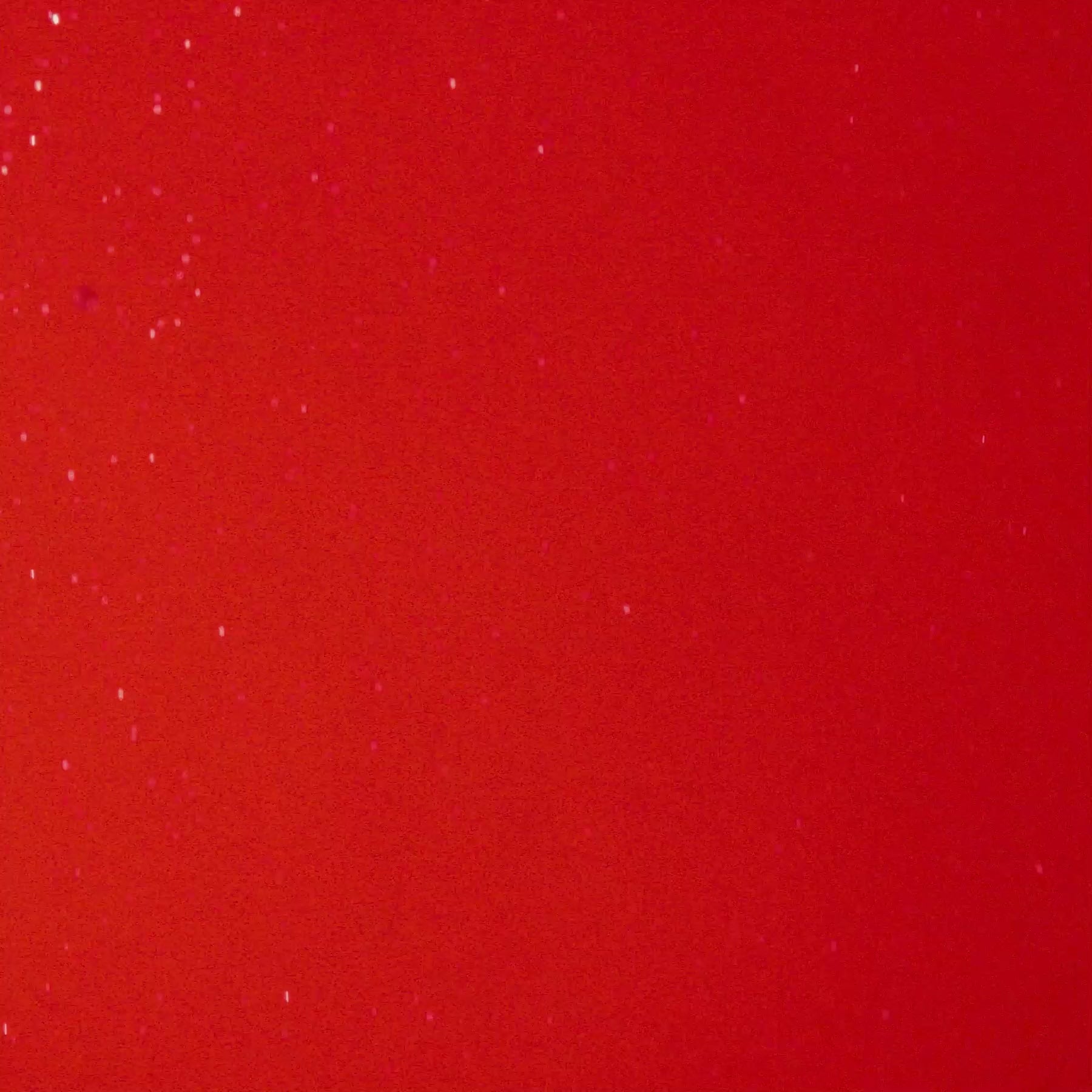 A vibrant red background representing the playful flavor of Strawberry inspired by sunshine-y coasts.