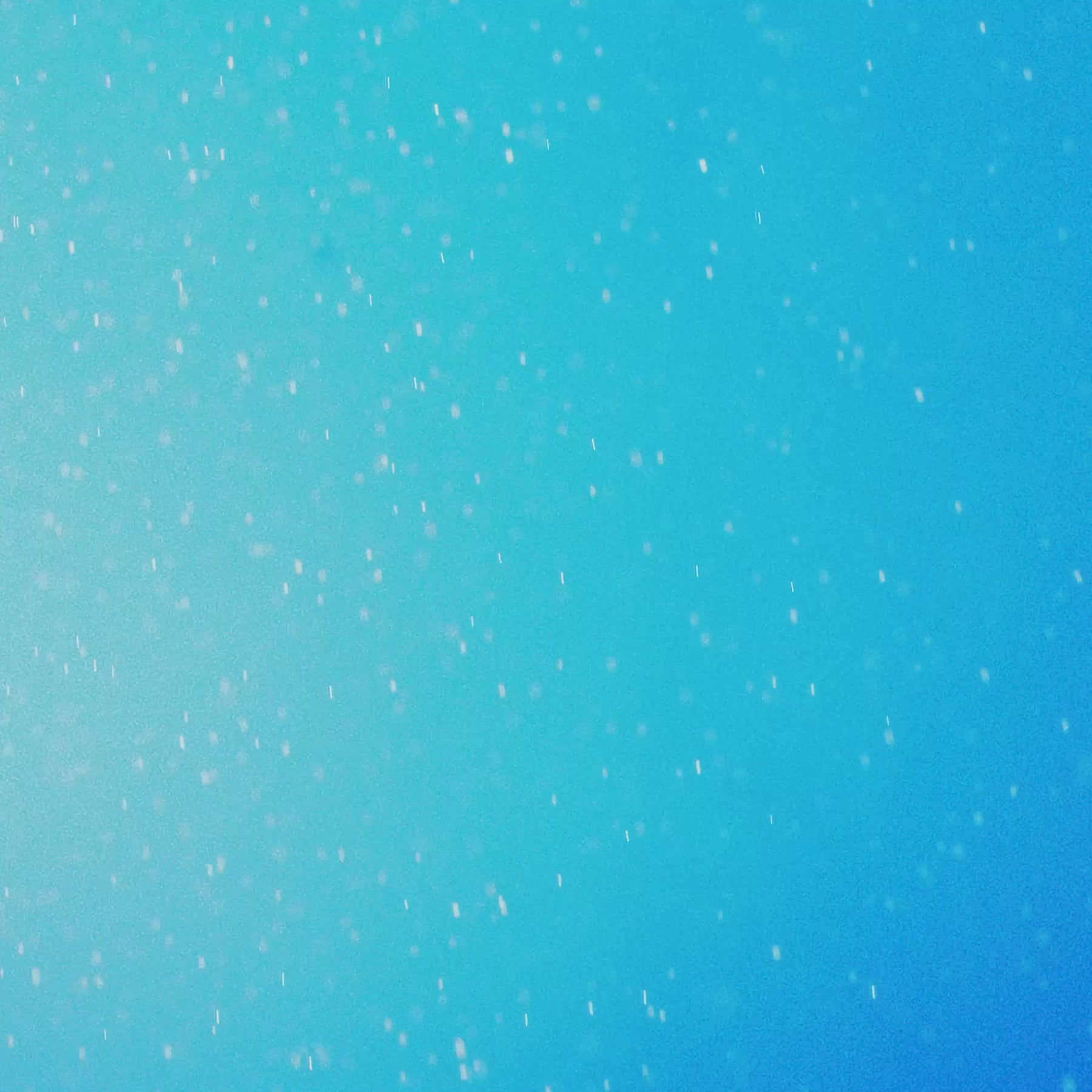 abstract blue background with soft light spots creating a dreamy atmosphere