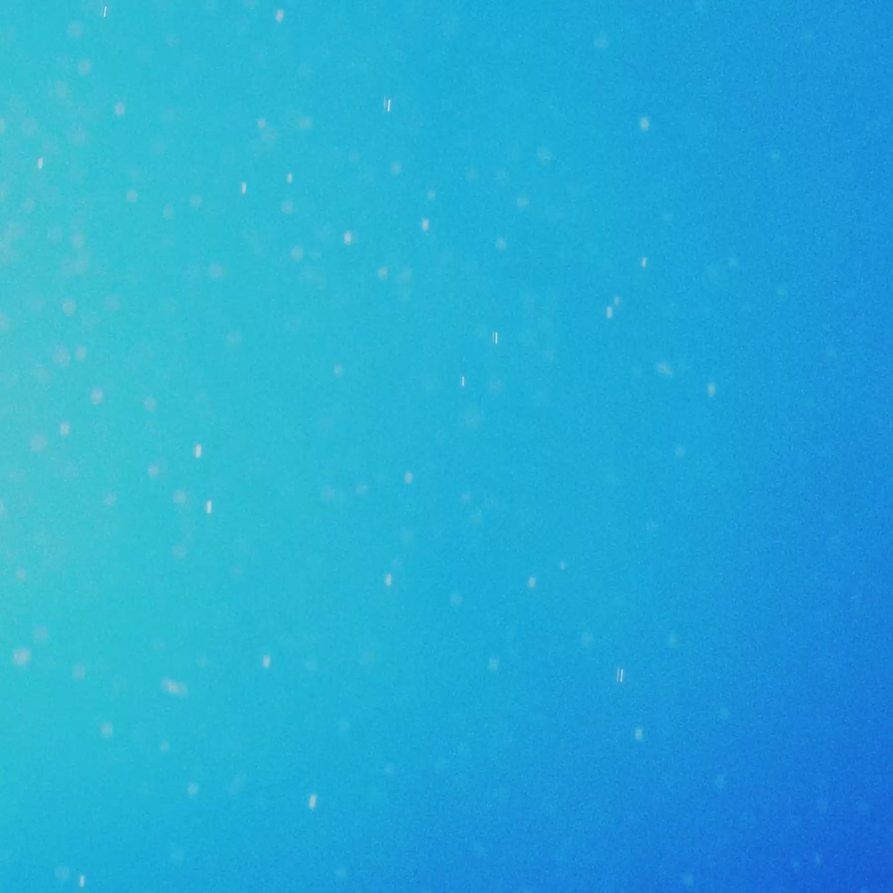 A vibrant blue background with soft, white specks, resembling a peaceful summer sky or water surface.
