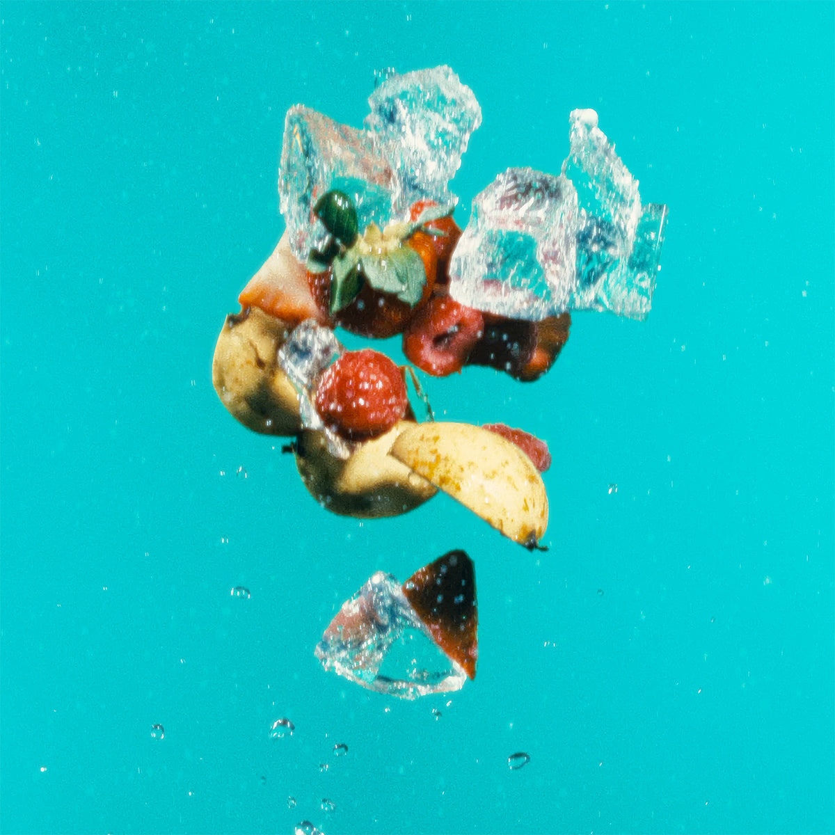 Close-up shot of natural elements in vibrant turquoise water, ideal for highlighting Guava Berry's tropical essence.