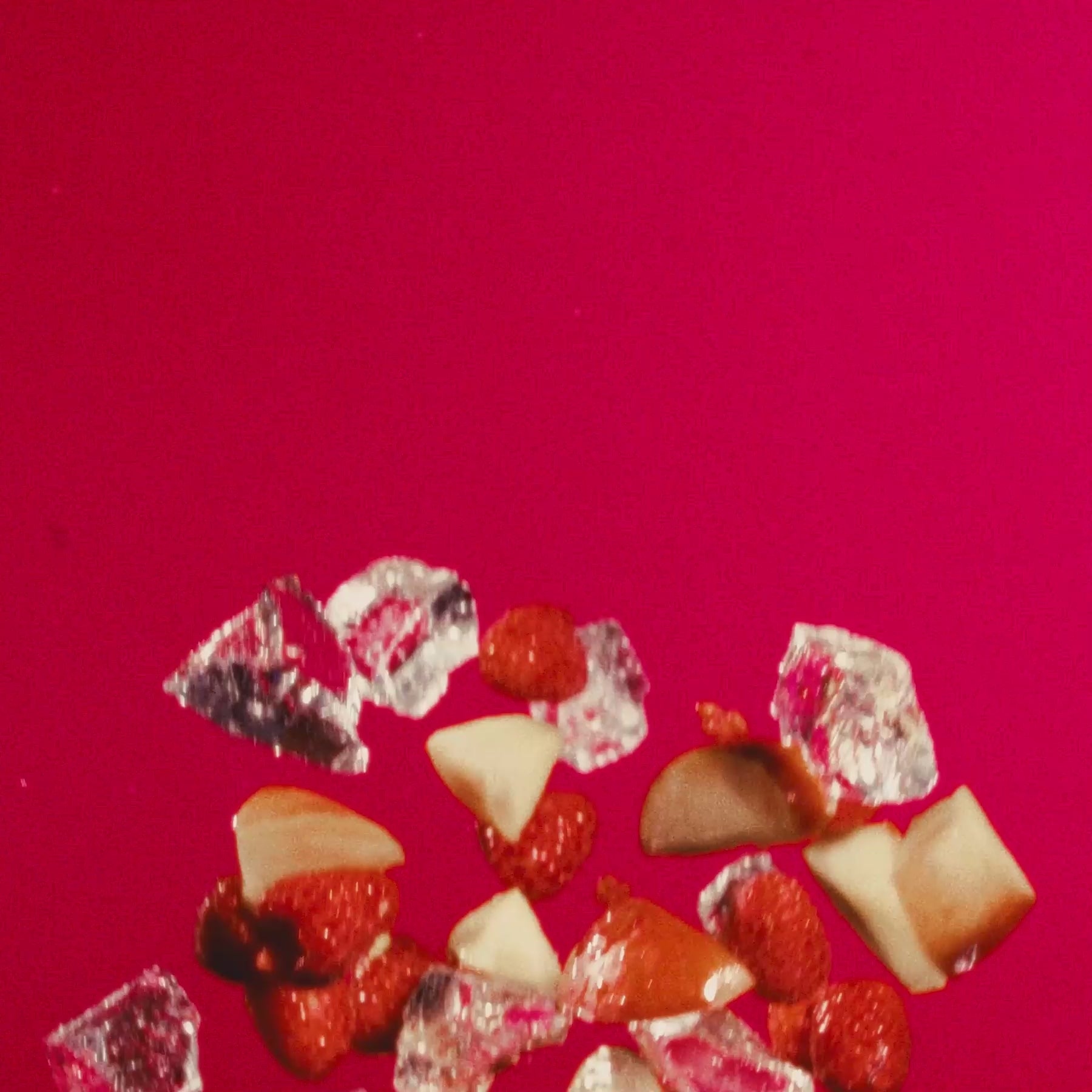 Colorful assortment of raspberries and nectarines with ice on a vibrant pink background, representing Raspberry Nectarine.