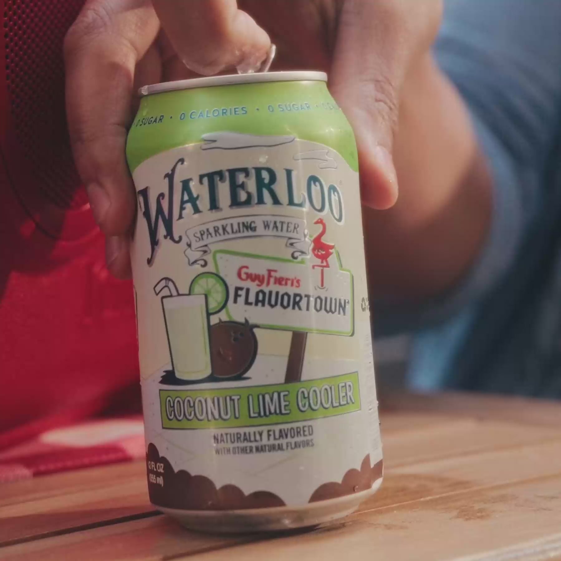Waterloo Coconut Lime Cooler sparkling water can being opened, showcasing refreshing flavors.